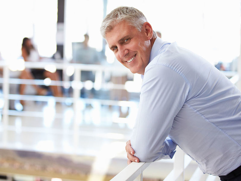 smiling middle aged man in office