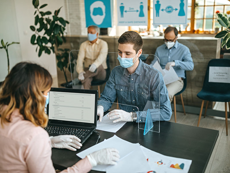 client and advisor with masks on