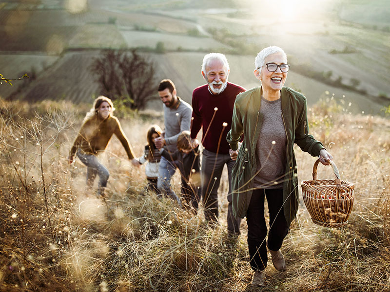 Multi-generational family, happily hiking
