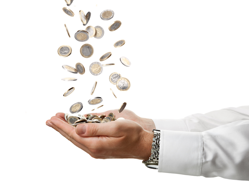 Cupped hands catching coins