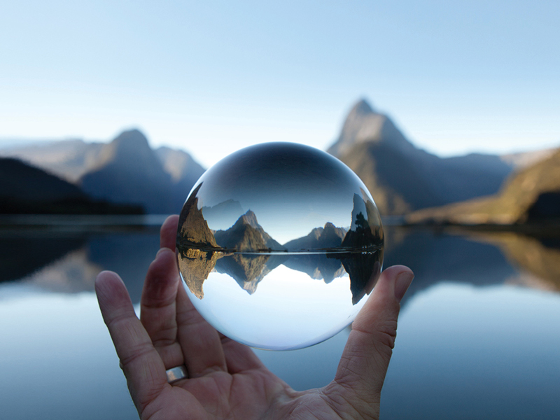 Crystal ball with lake and mountains