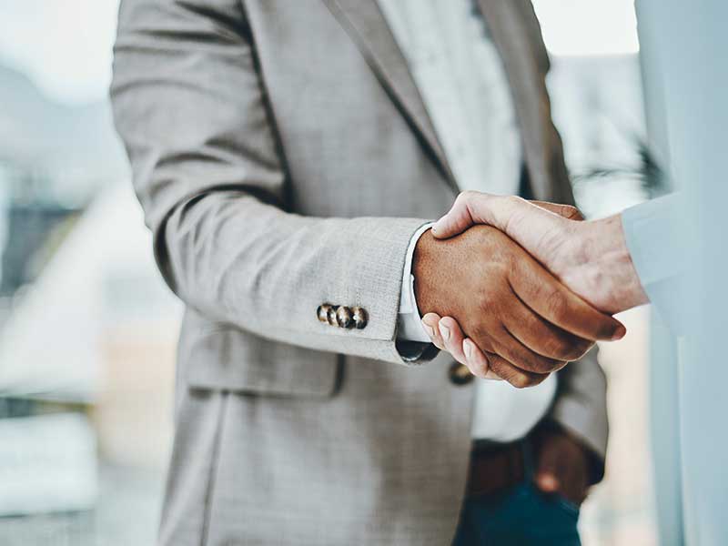 Two people shaking hands