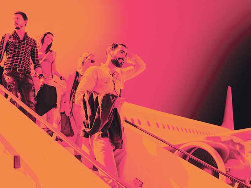People exiting a plane looking tired