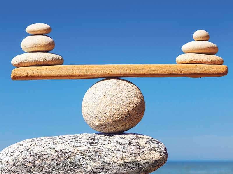 Rock sculpture on the beach balancing mounds of pebbles on top