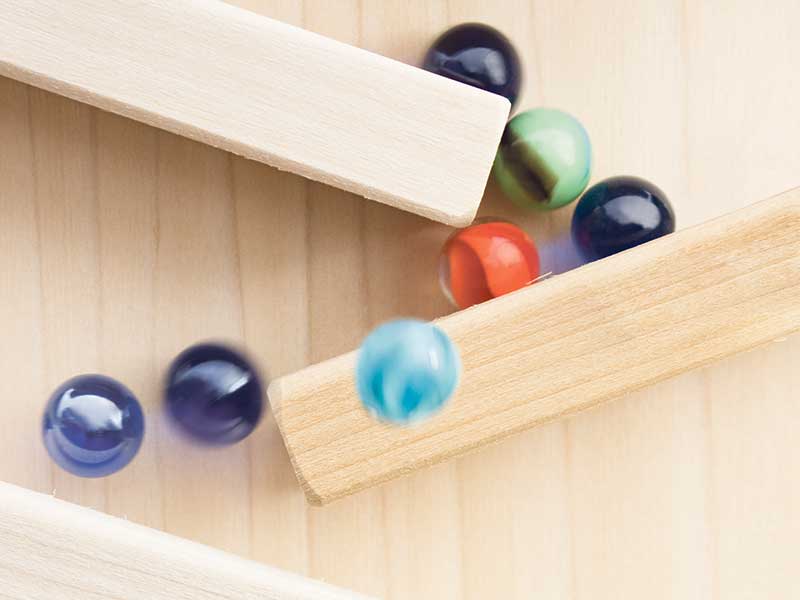 Marbles sliding on a wood array