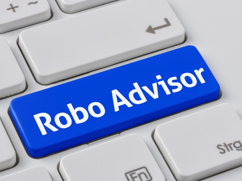 A keyboard with a blue button - Robo Advisor