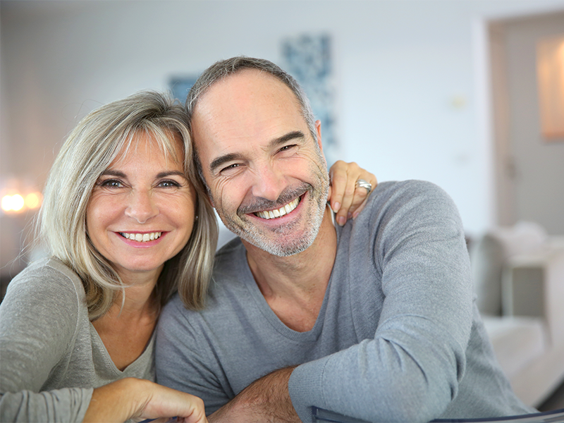 Cheerful senior couple hugging each other