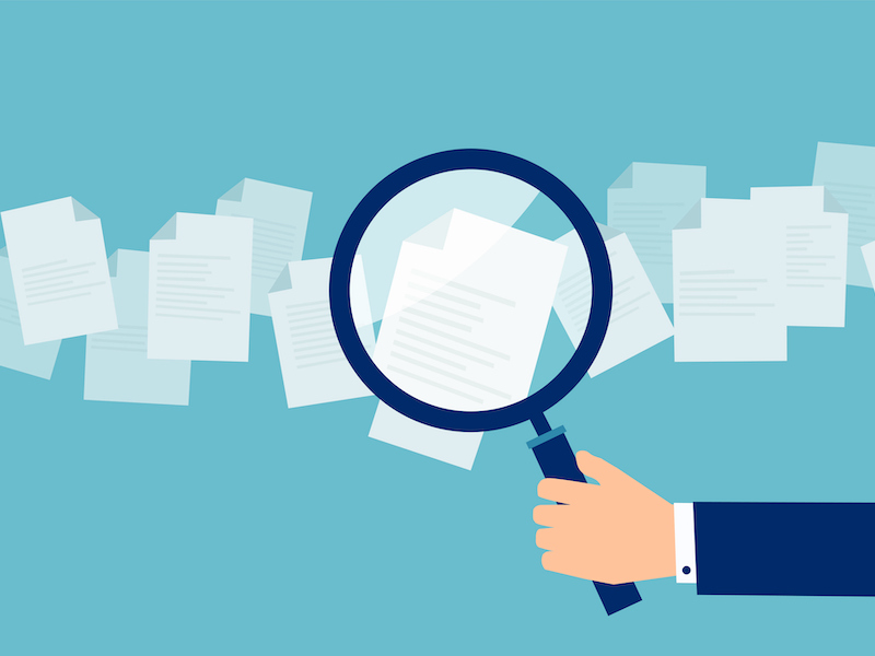 Magnifying glass on documents