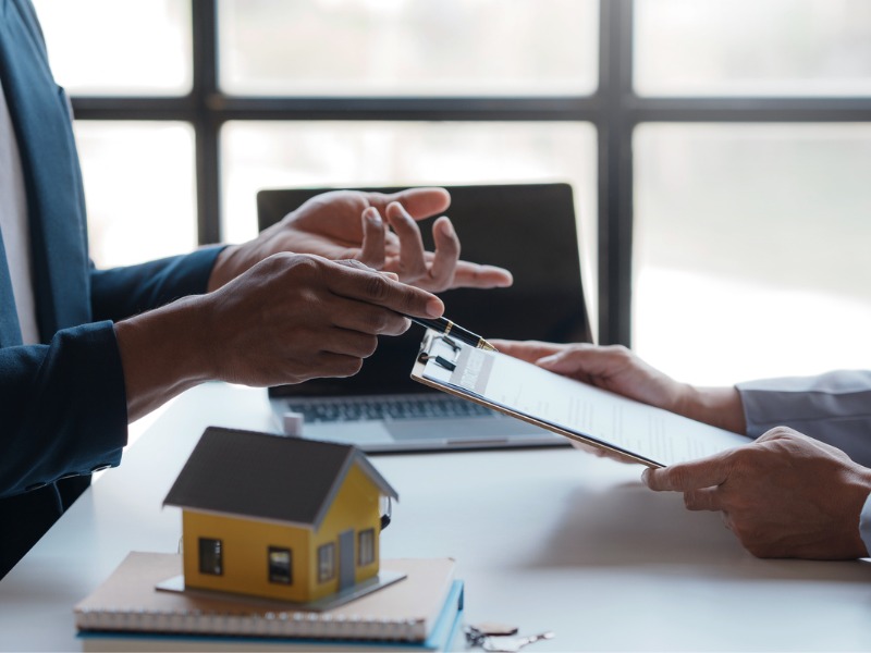 Real estate agent talking to a client