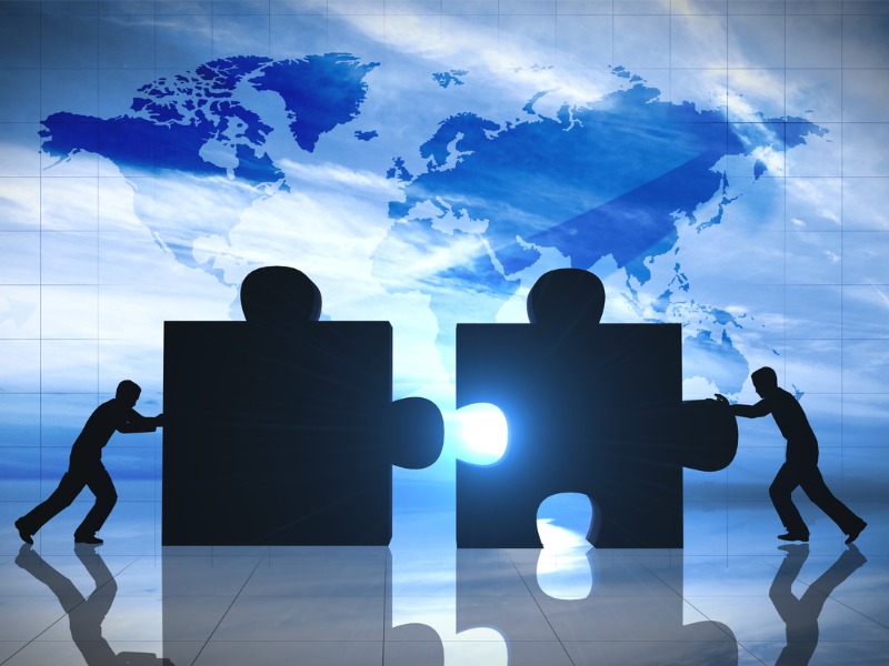 People push puzzle pieces toward each other