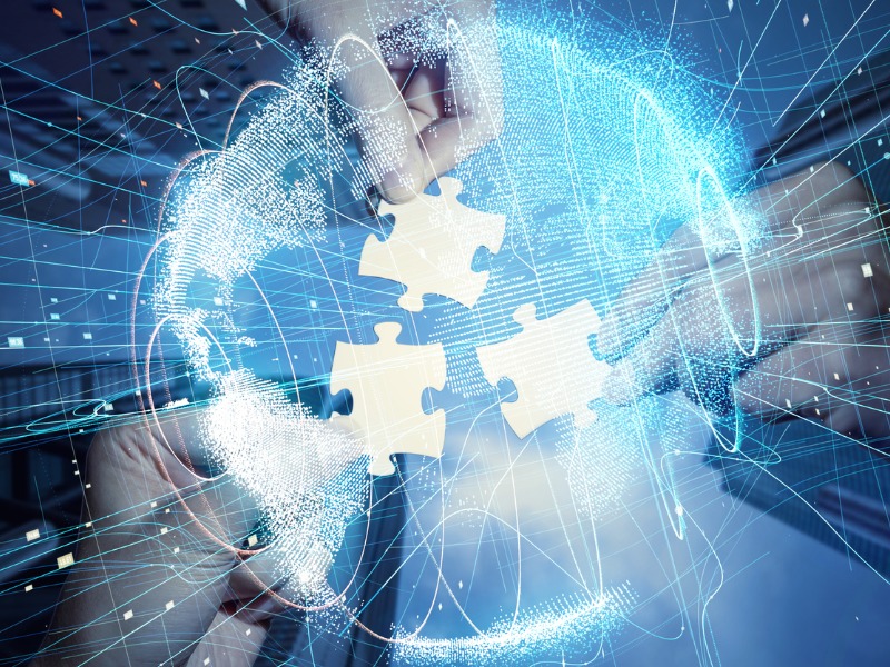 Pieces of jigsaw puzzle and a global network