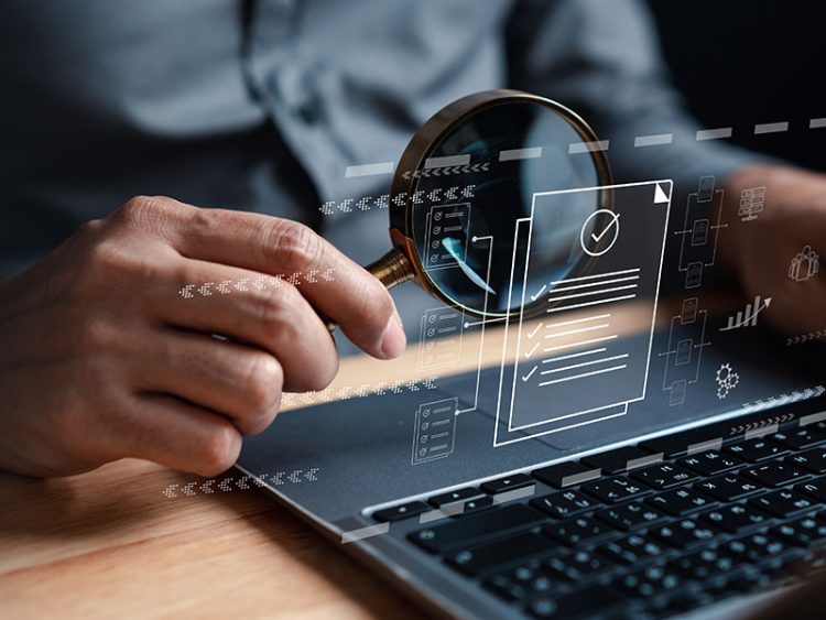 Examining a document on a computer with a magnifying glass