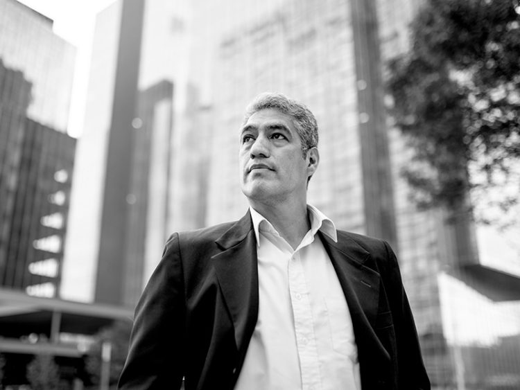 Low angle photo of businessman looking away
