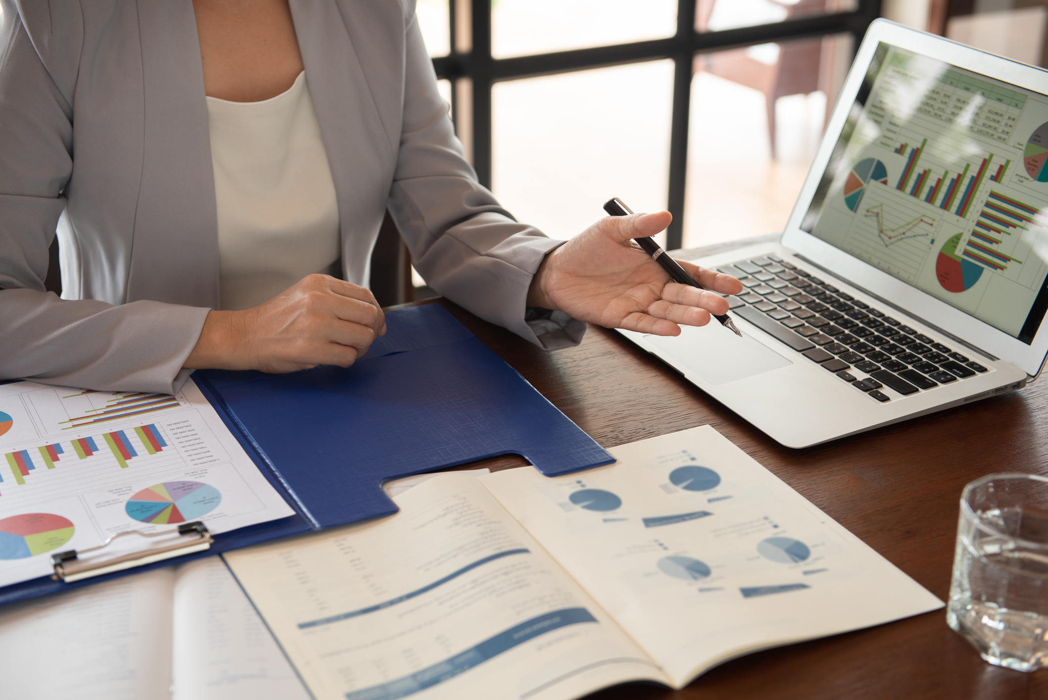 Female advisor looking at tables and charts and planning