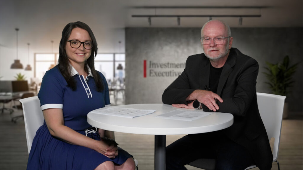Investment Executive staff at a table with notes