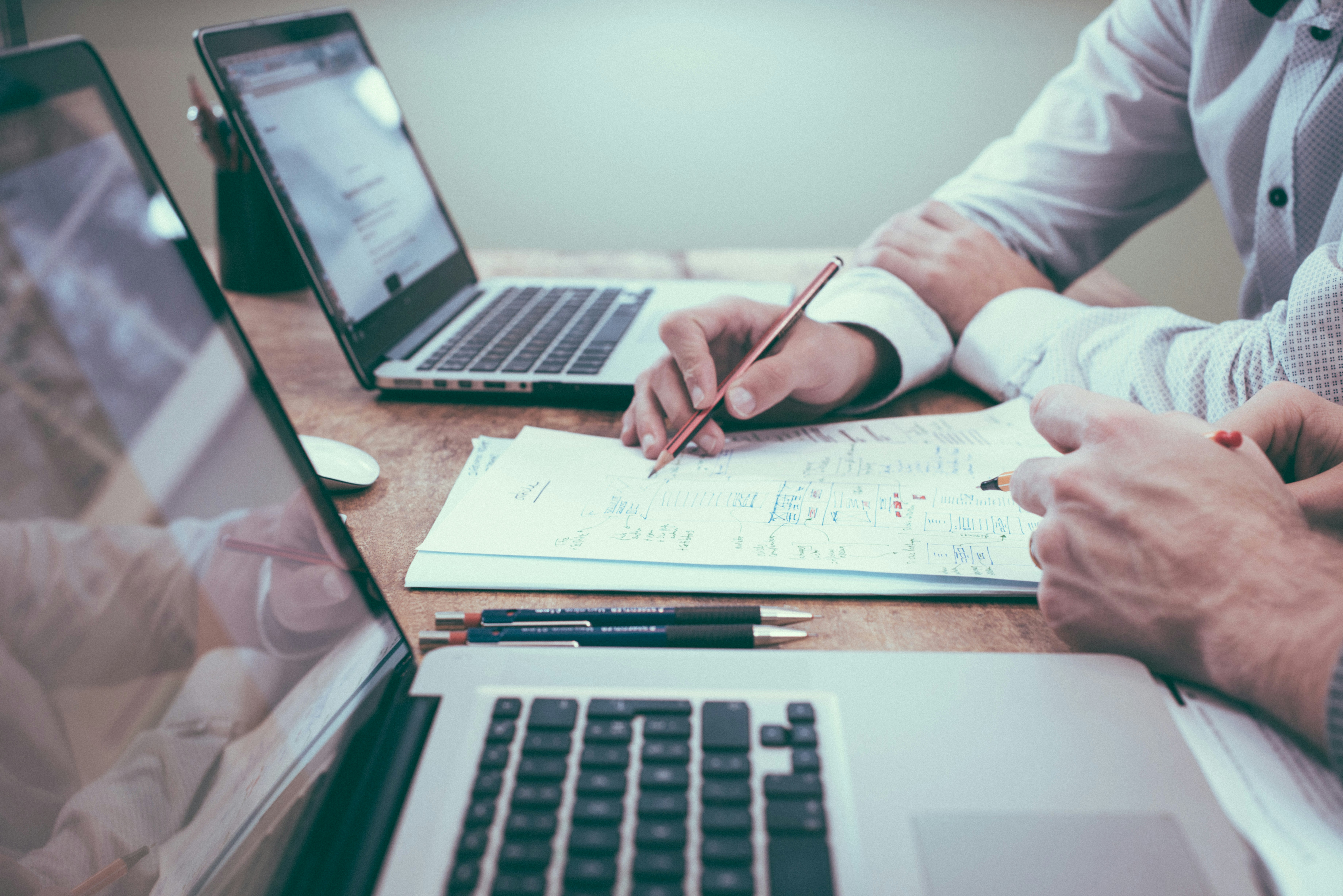 Meridian portfolio managers collaborating on investment strategy